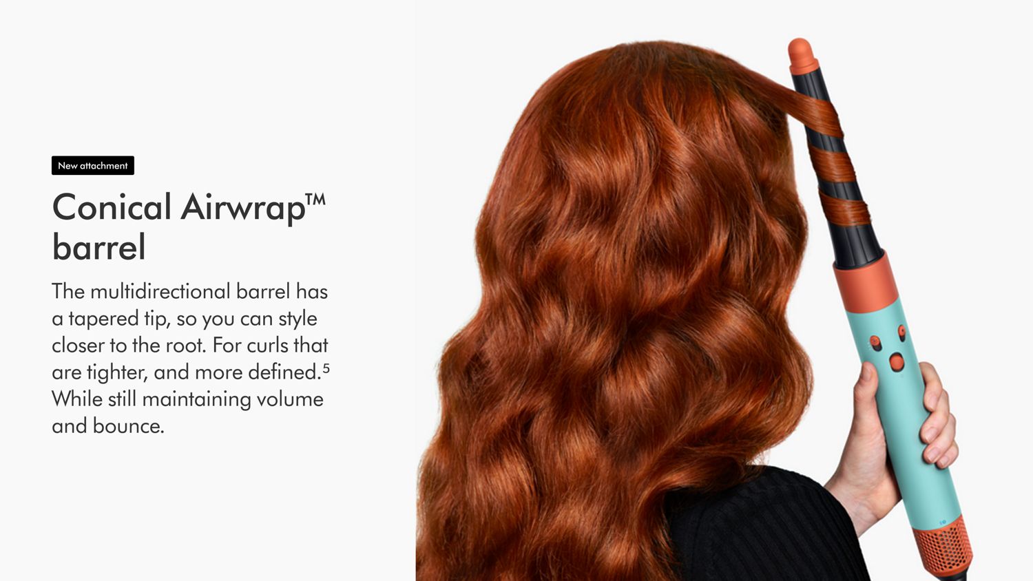View of back of woman’s hair as she curls it with the Dyson Airwrap ID.
