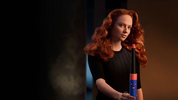 A model using the Vinca Blue Dyson Airwrap i.d multi-styler and dryer with Wave+Curl diffuser.