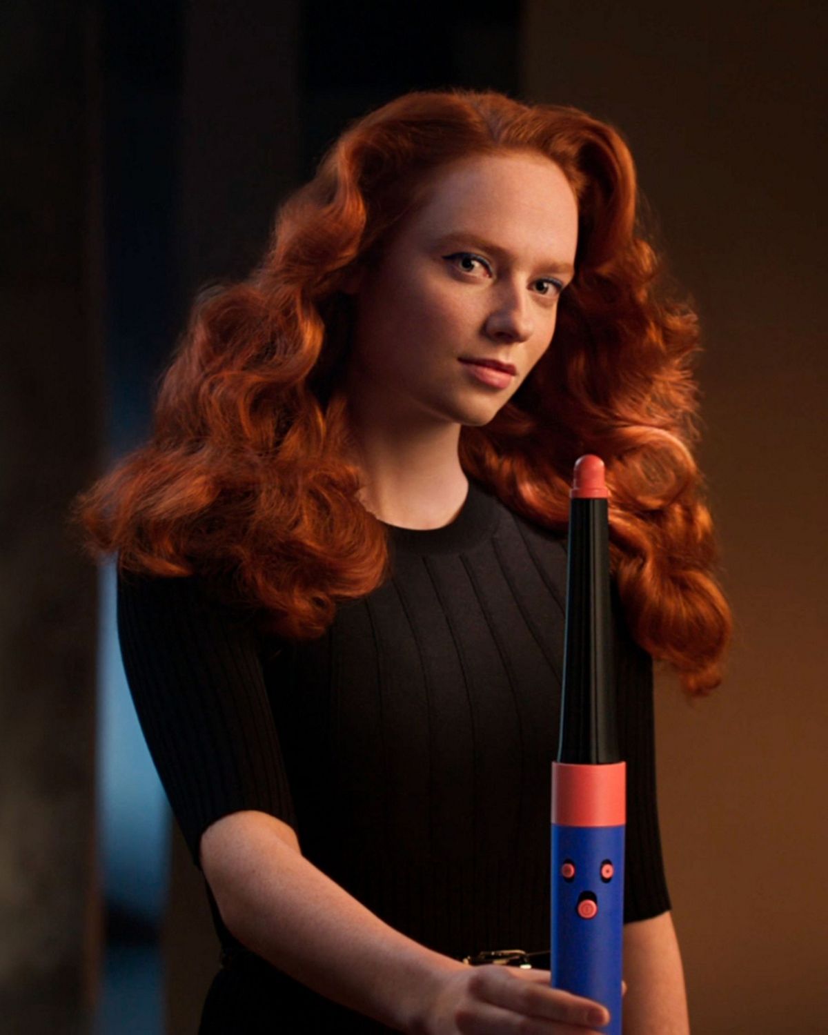 A model using the Vinca Blue Dyson Airwrap i.d multi-styler and dryer with Wave+Curl diffuser.