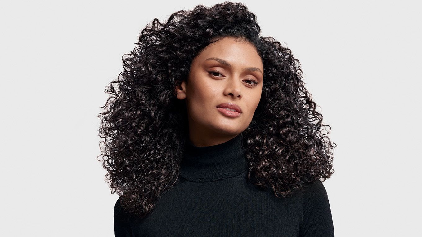 Model with styled, curly hair. Model with styled