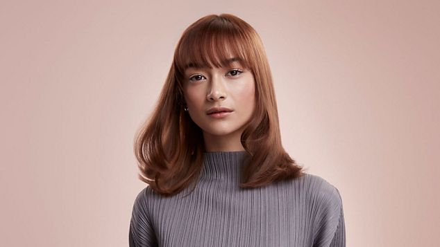 Model with blow-dried hair.