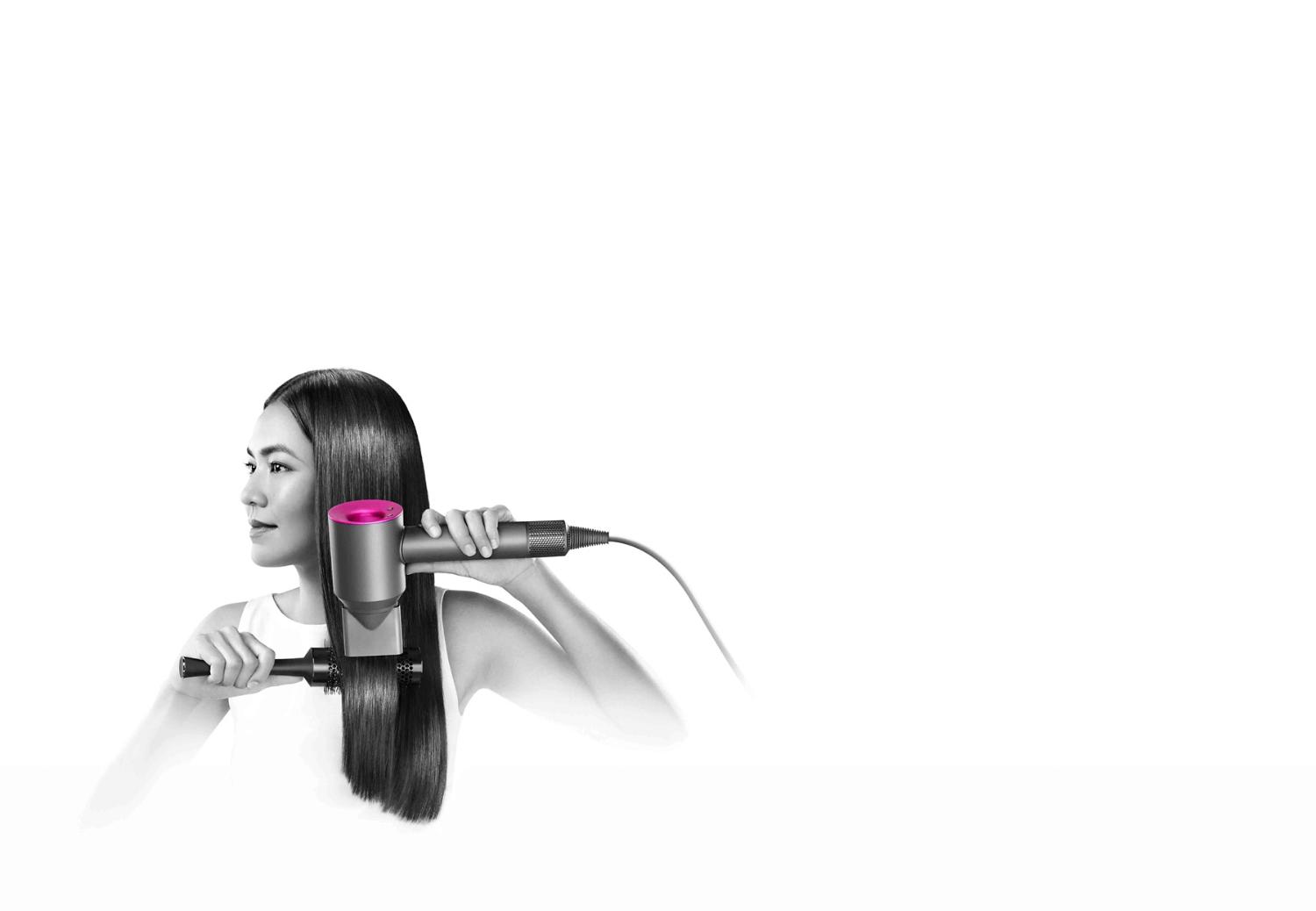 Model with Dyson Supersonic™ hair dryer