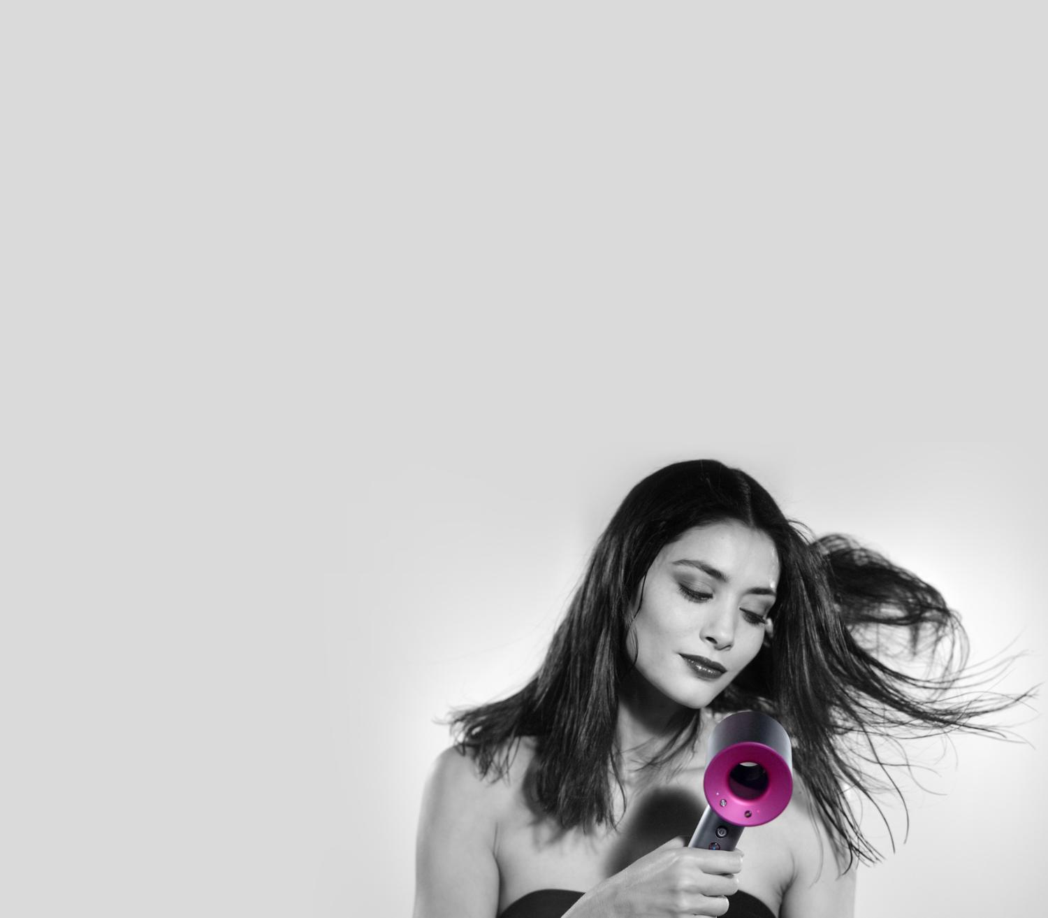 Model with Dyson Supersonic™ hair dryer