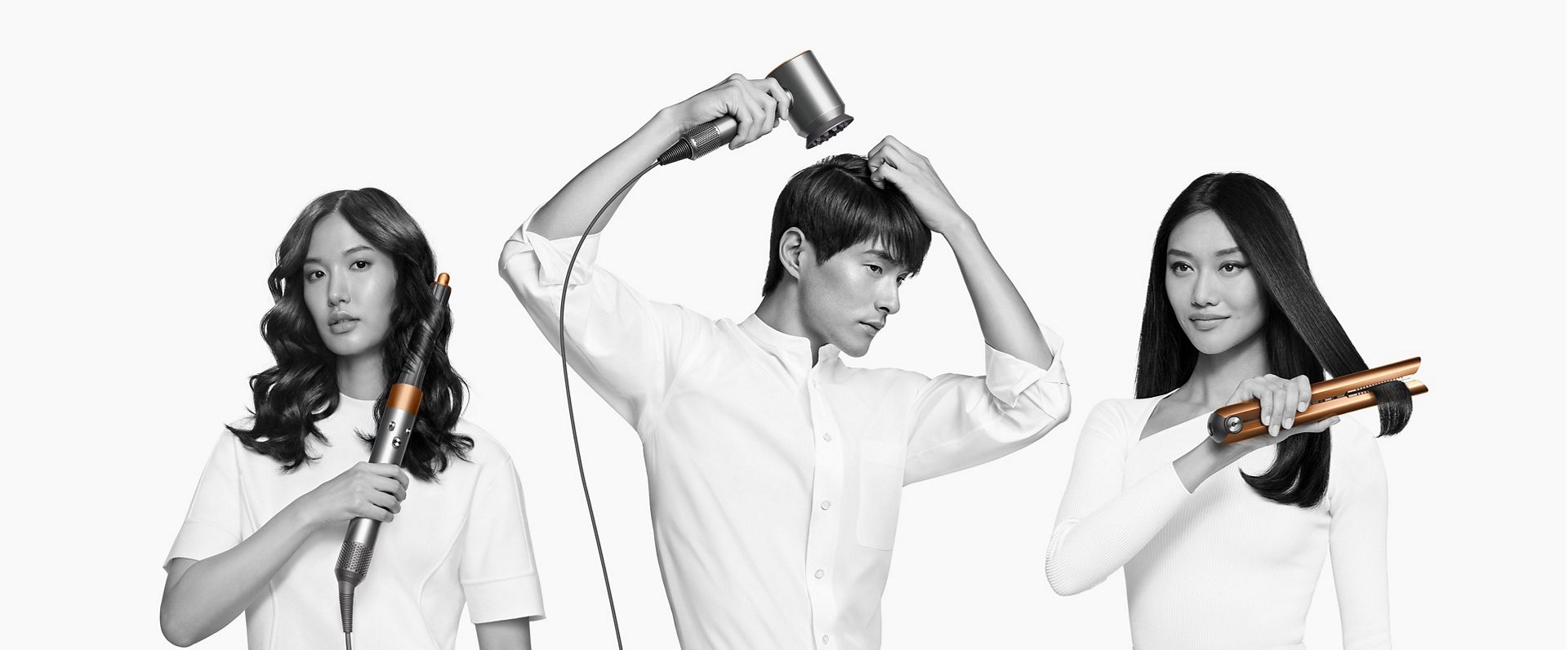 Three models using the Dyson hair care range to dry or style their hair