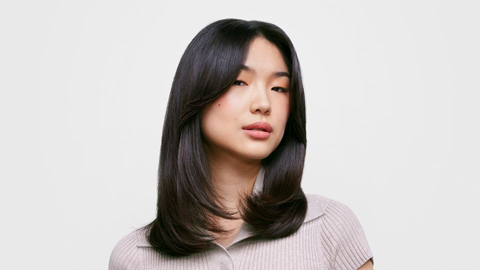 Female model with long, straight hair.