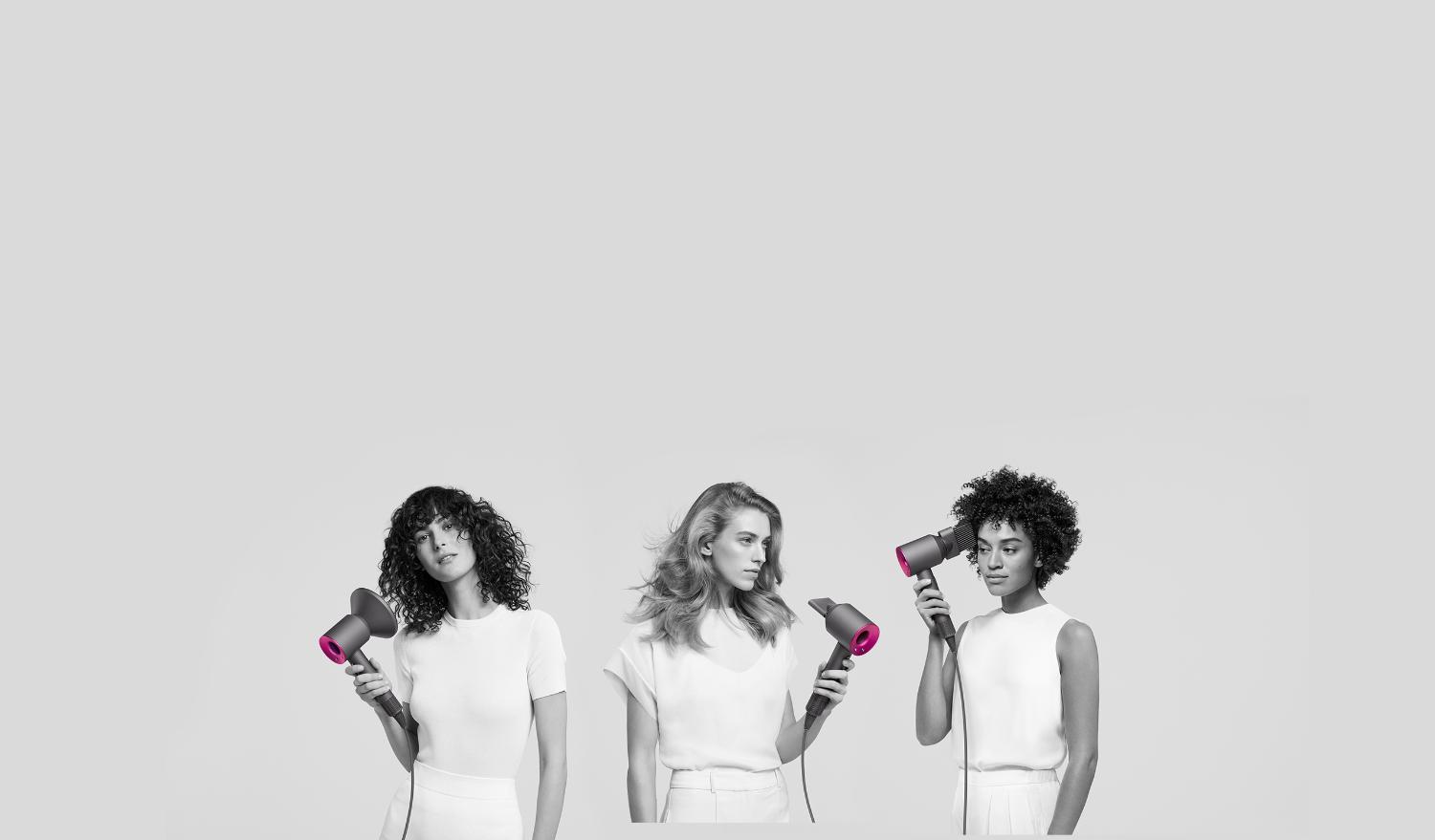 Three women using the Dyson Supersonic hair dryer