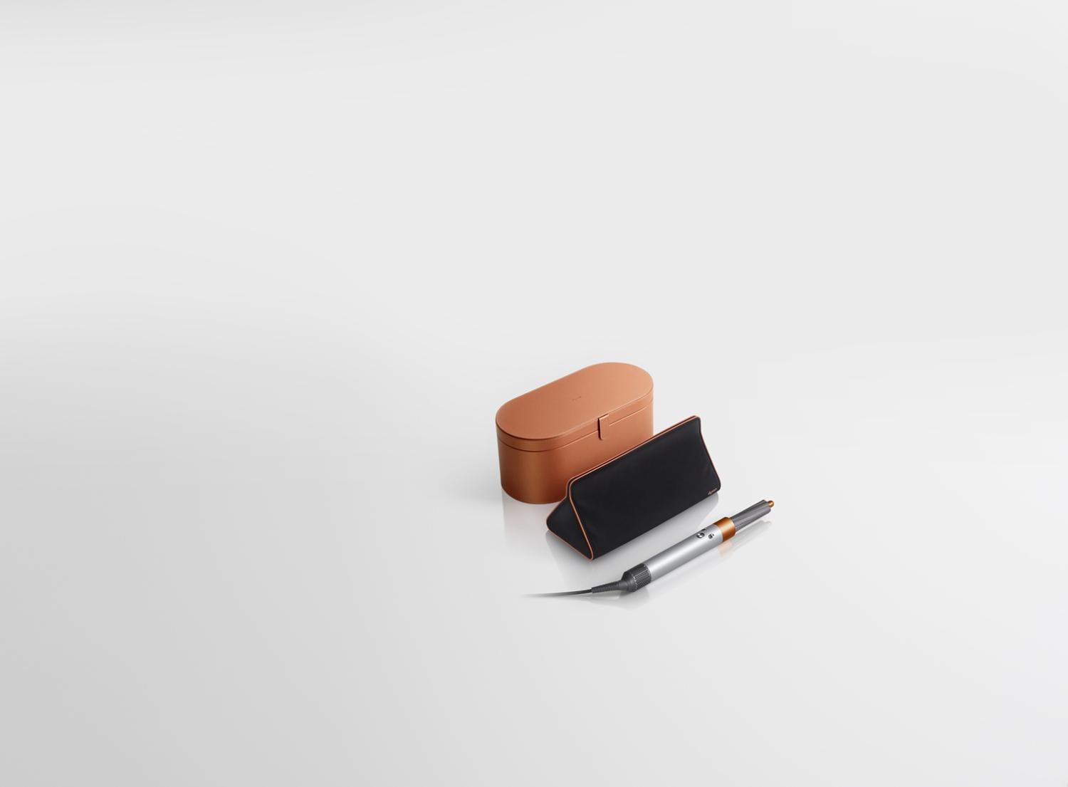 Copper Dyson Airwrap styler with presentation case and storage bag