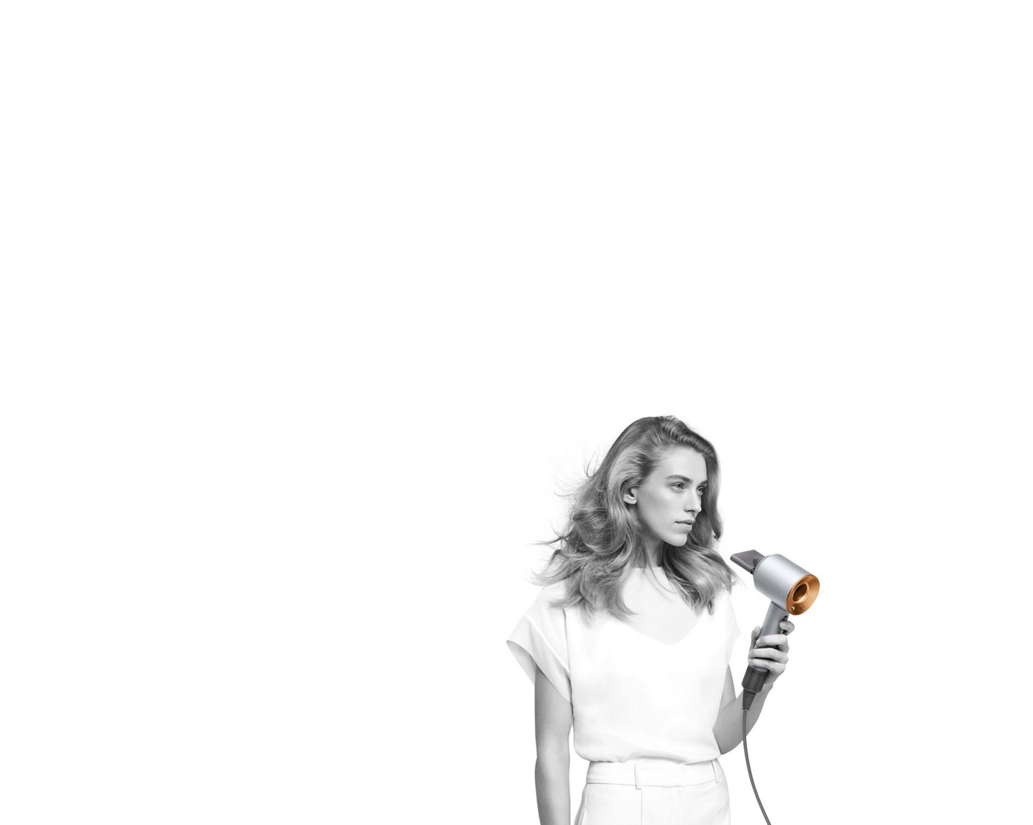 Copper Dyson Airwrap styler with storage bag