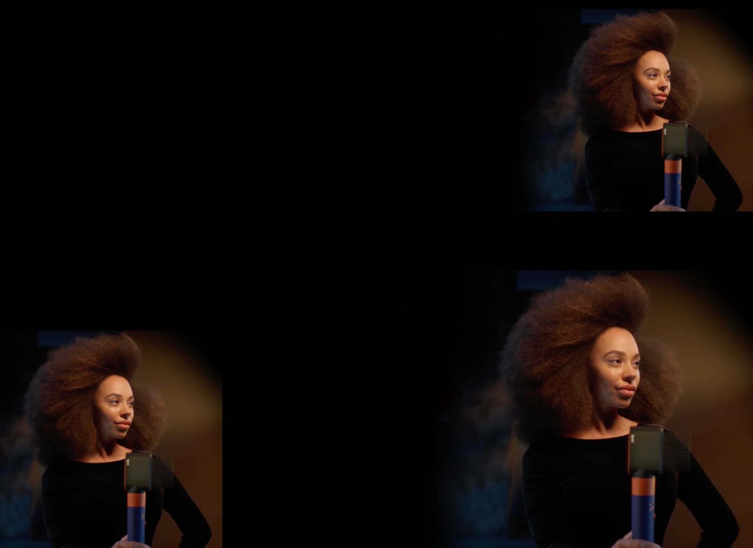 A model holding the Dyson Airwrap i.d. multi-styler and dryer with Fast dryer.