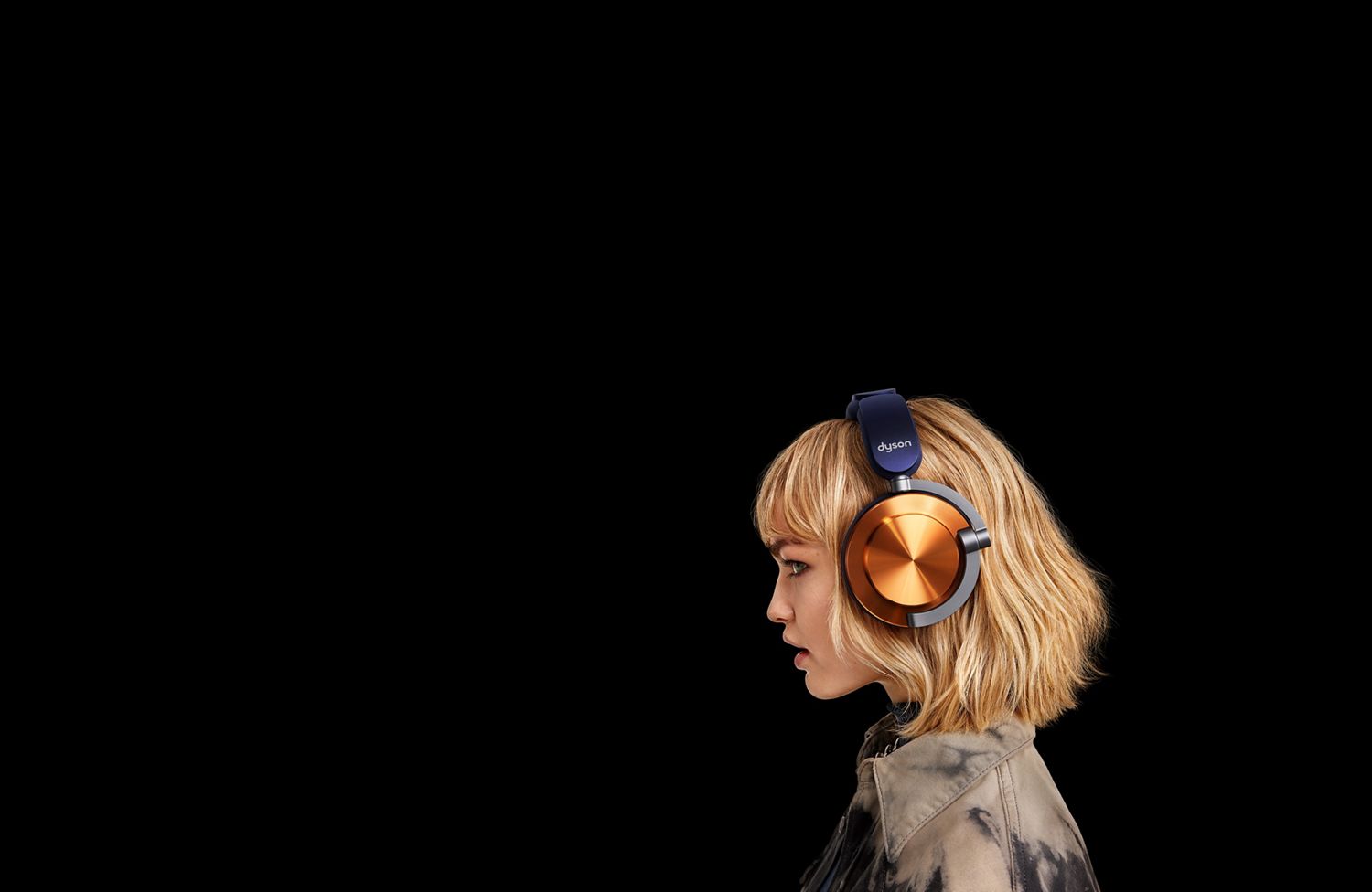 A side profile of a model wearing the Dyson OnTrac headphones.