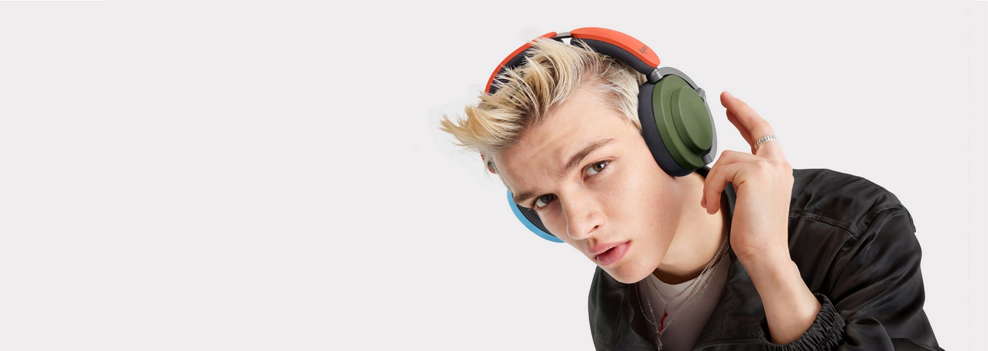 A model wearing the Dyson OnTrac headphones.
