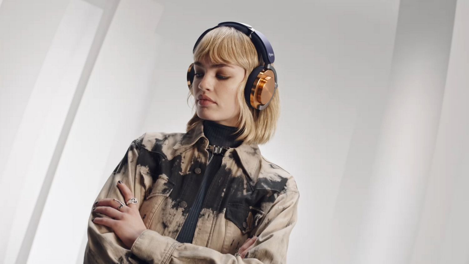 Model wearing the Dyson OnTrac headphones.