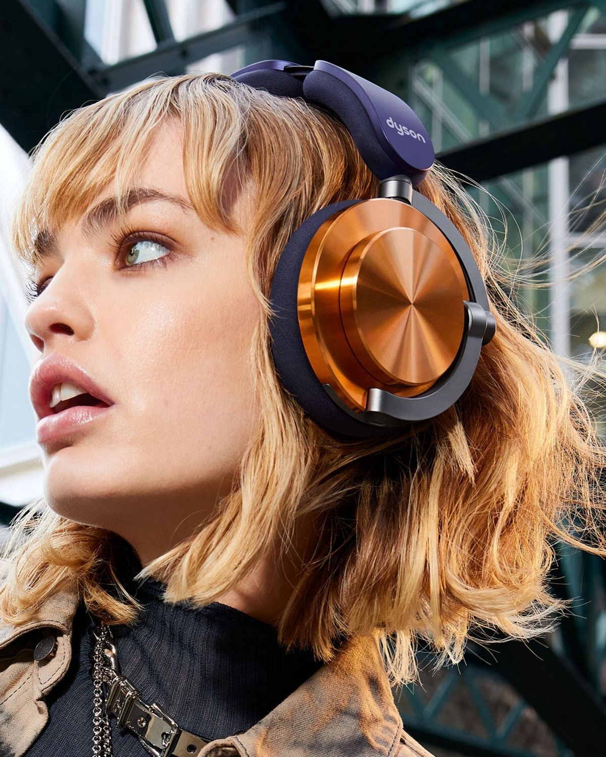 Model wearing the Dyson OnTrac headphones.