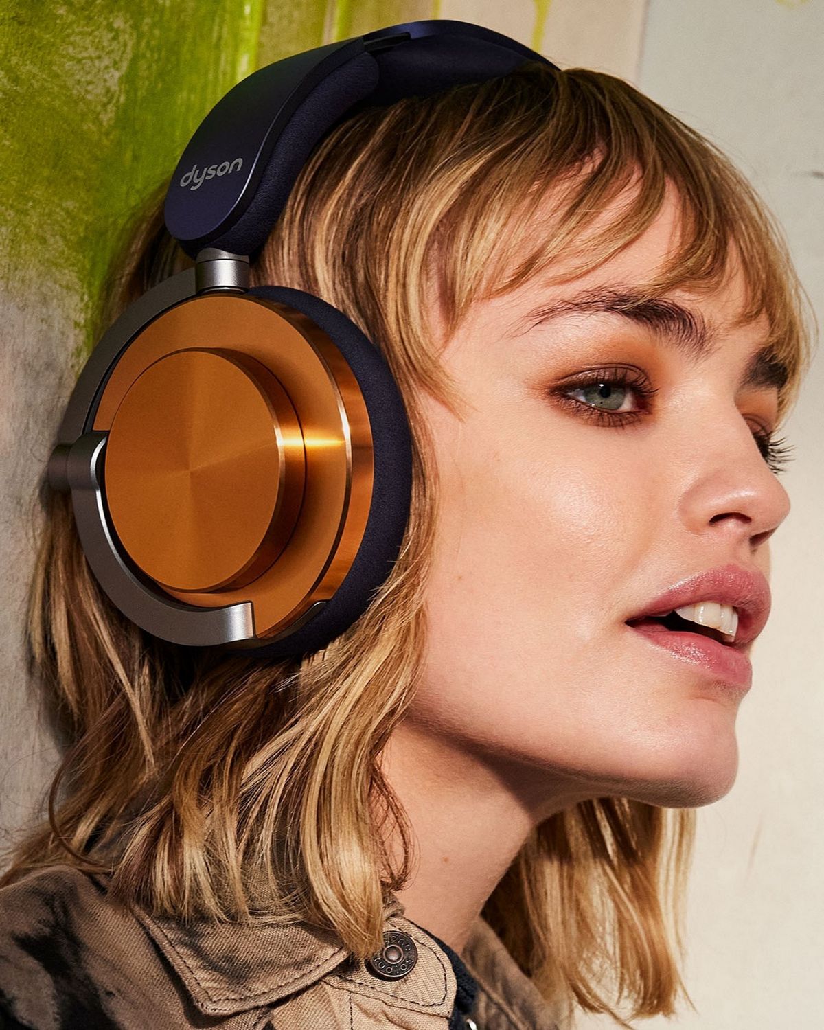 Model wearing the Dyson OnTrac headphones.