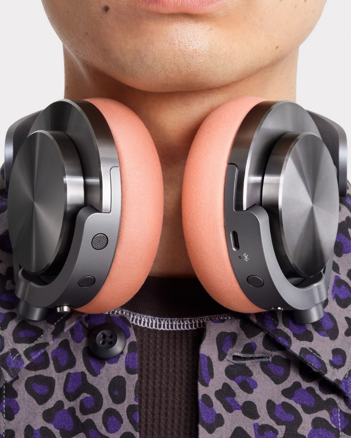 Model wearing the Dyson OnTrac headphones.