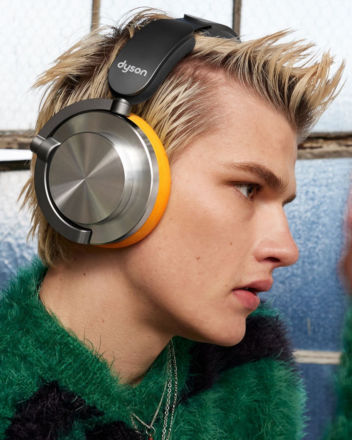 Model wearing the Dyson OnTrac headphones.