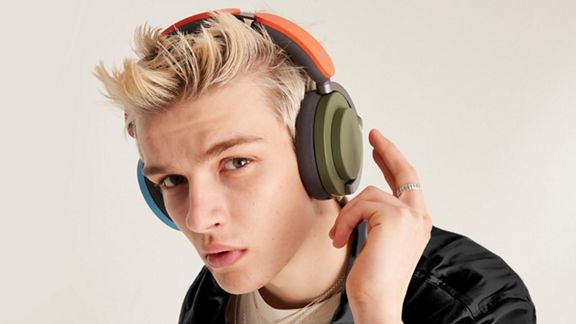 Model wearing the Dyson OnTrac headphones.