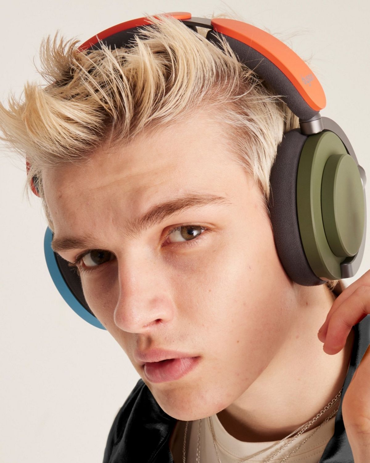 Model wearing the Dyson OnTrac headphones.