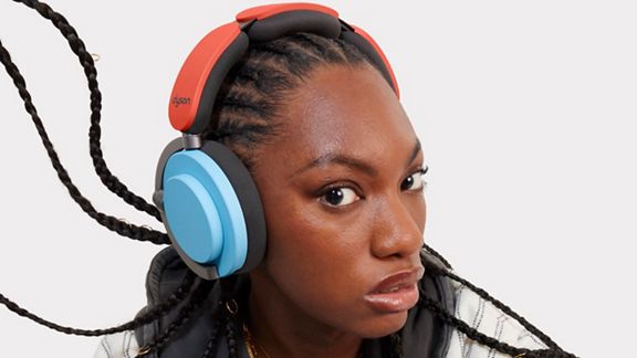 Model wearing the Dyson OnTrac headphones.