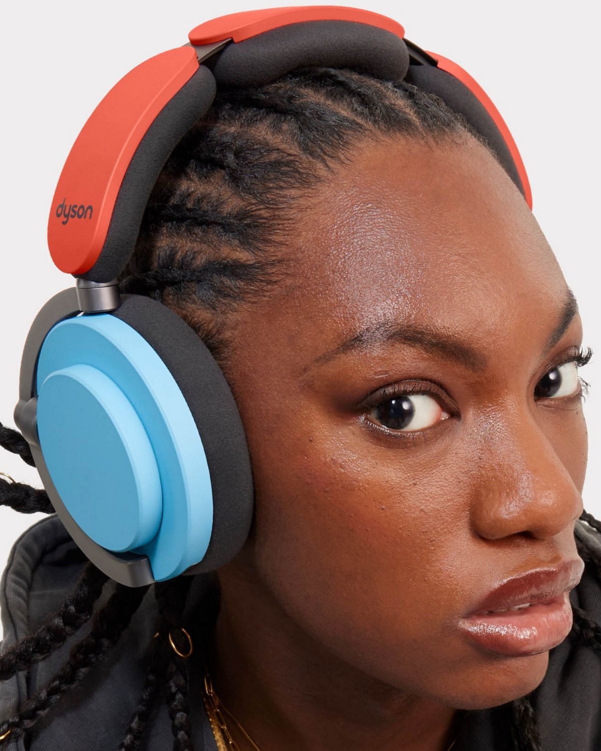 Model wearing the Dyson OnTrac headphones.