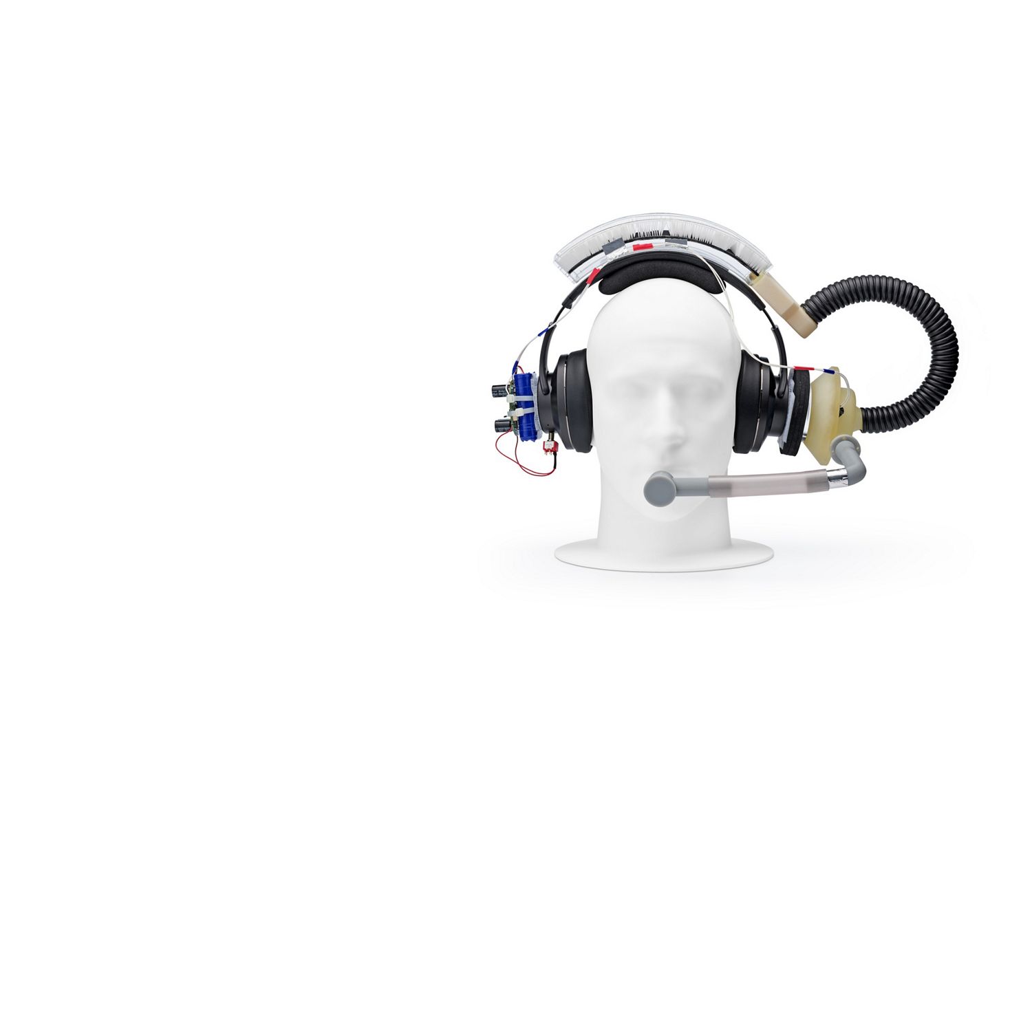 Mannequin  head wearing prototype, with a mouthpiece, wires and tubing exposed