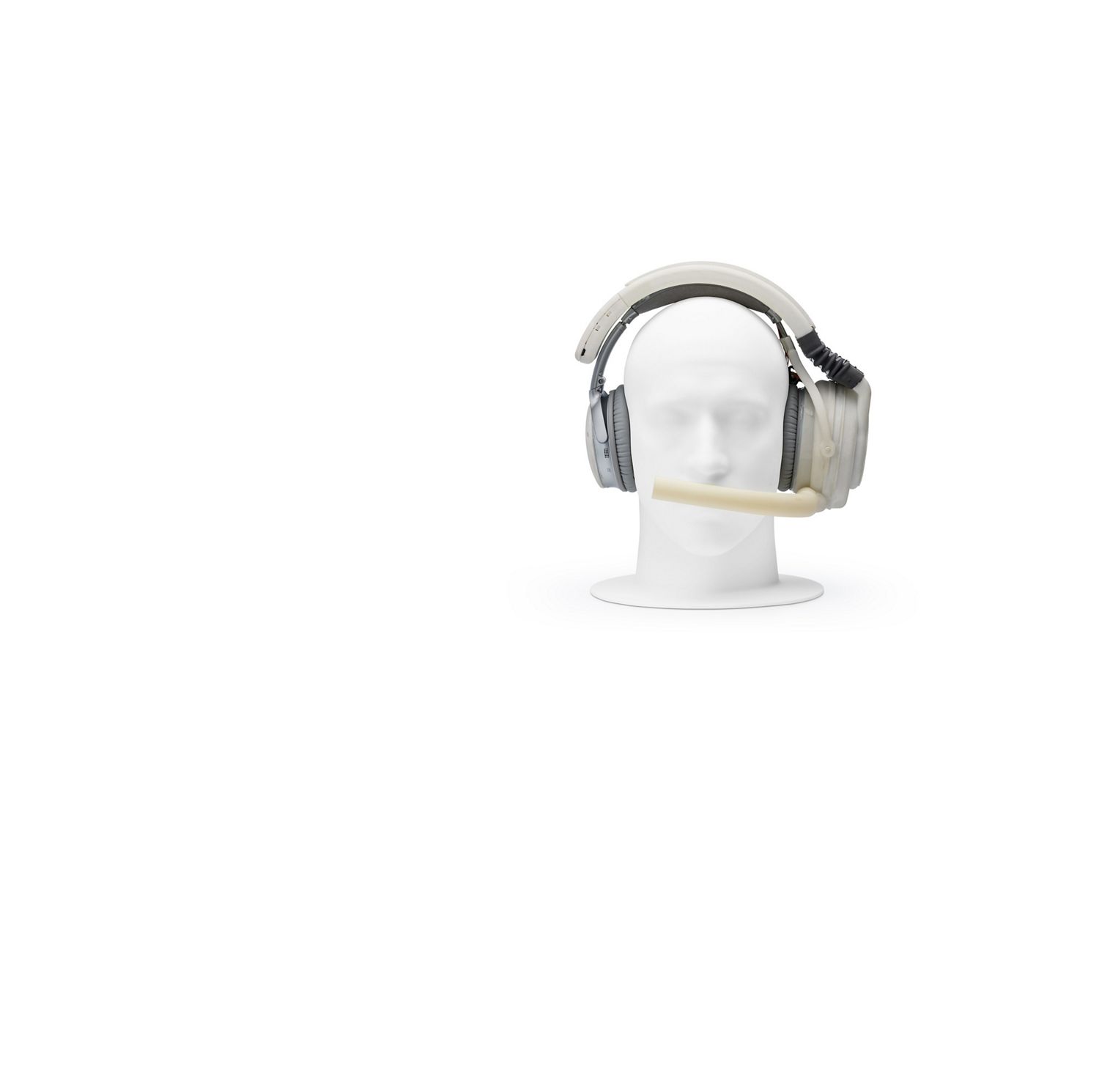 Mannequin head wearing prototype headphones, with mouthpiece