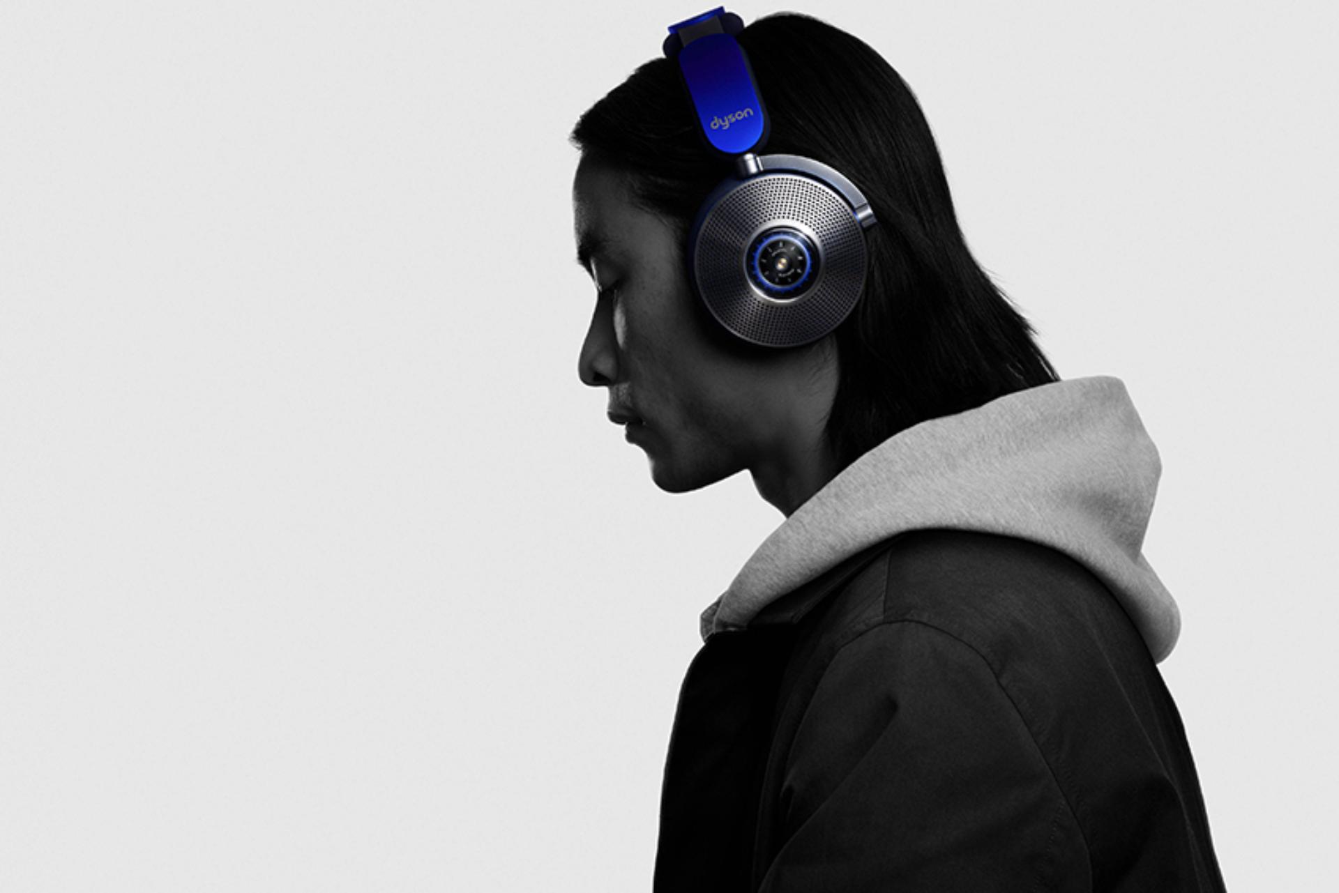 woman and men wearing the new Dyson Zone Headphones