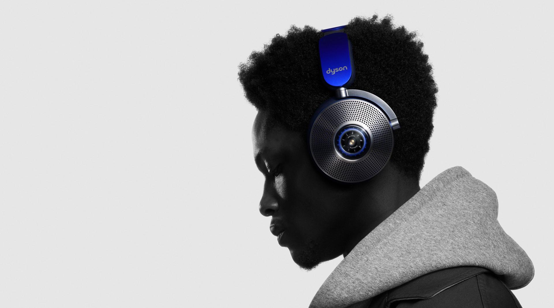 Side view of man as he wears Dyson Zone headphones with air purification.