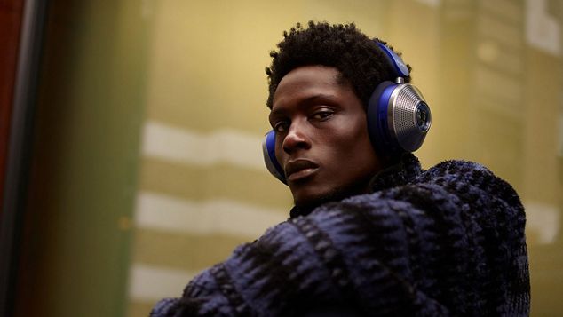 Man wearing Dyson Zone noise-cancelling headphones.