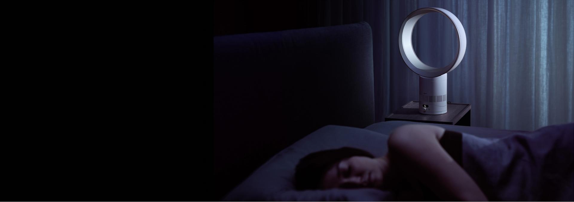 The Dyson Cool CF1 fan cooling a person as they sleep.