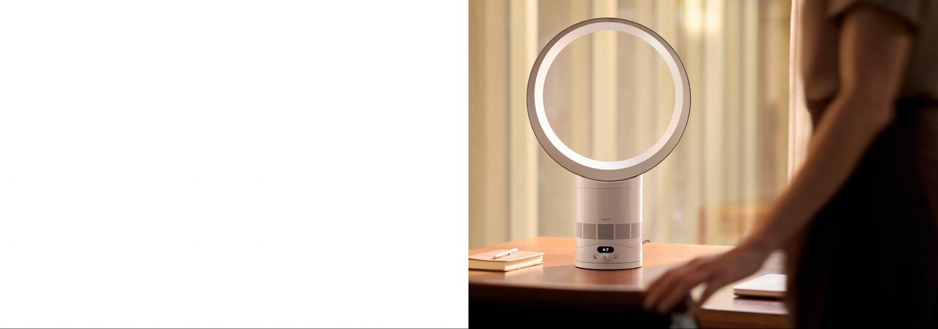 The Dyson Cool CF1 fan on the desk of a home office.