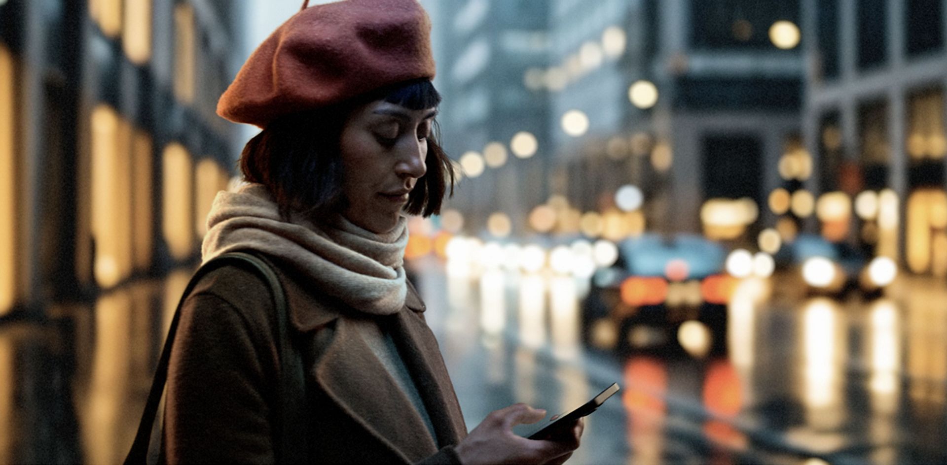 A woman controls her Dyson Hot+Cool HF1 Remote Link Pre-heat fan heater through the MyDyson app as she leaves work.