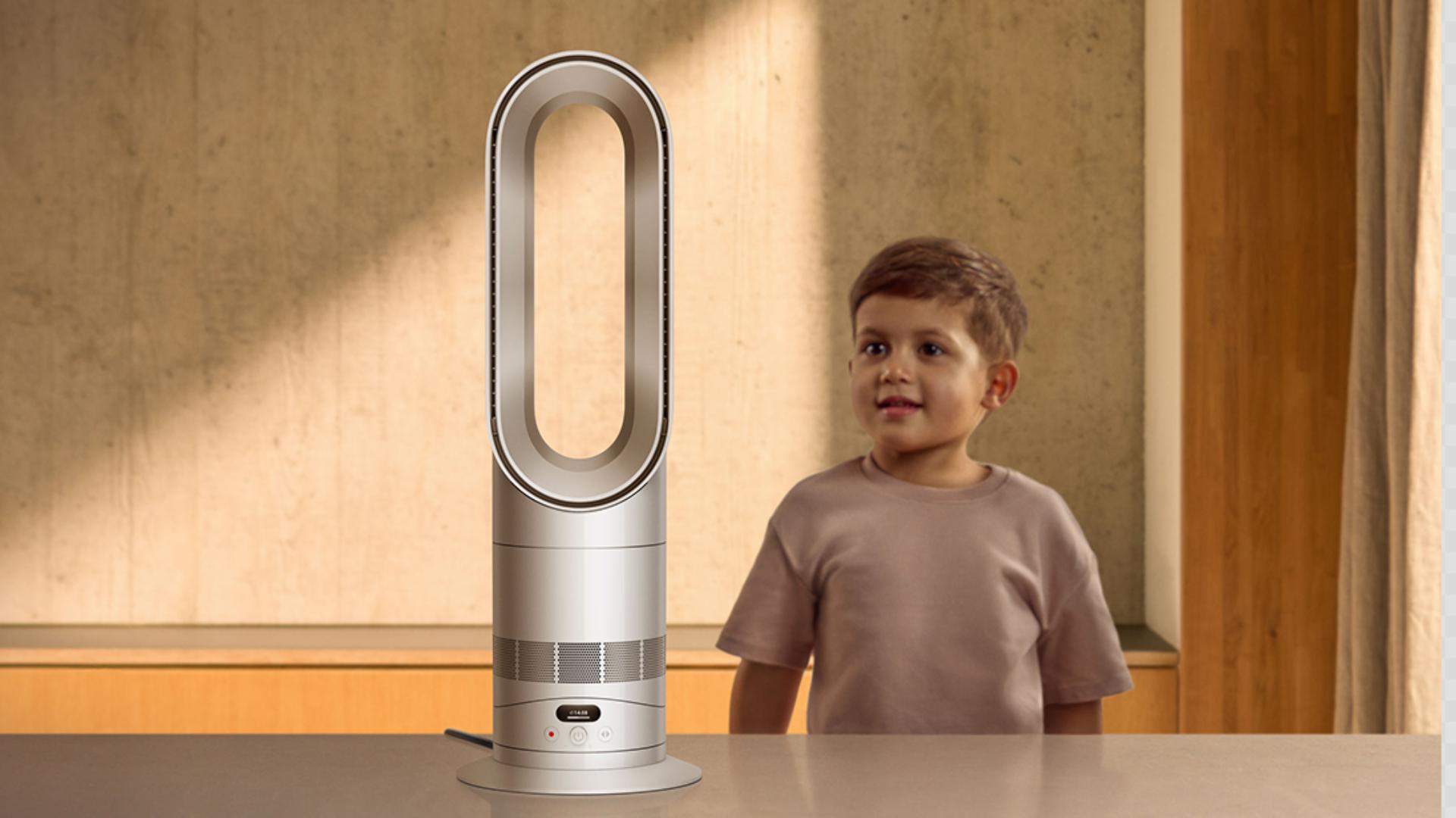 The Dyson Hot+Cool HF1 Remote Link Pre-heat heater and cooling fan next to a small child.