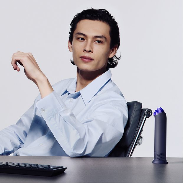 The Dyson HushJet Mini Cool portable fan placed on the Charging Stand.