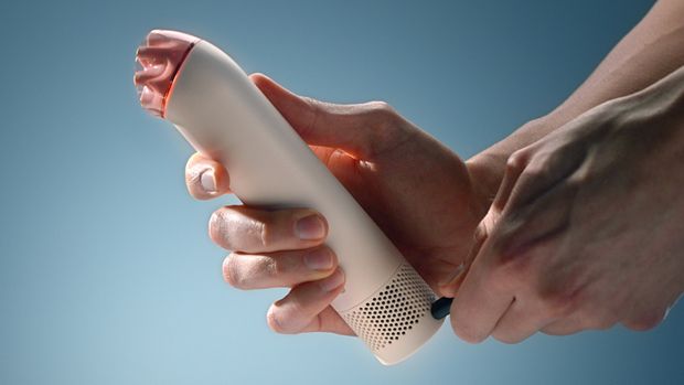 The charging cable is connected to the Dyson HushJet Mini Cool fan.