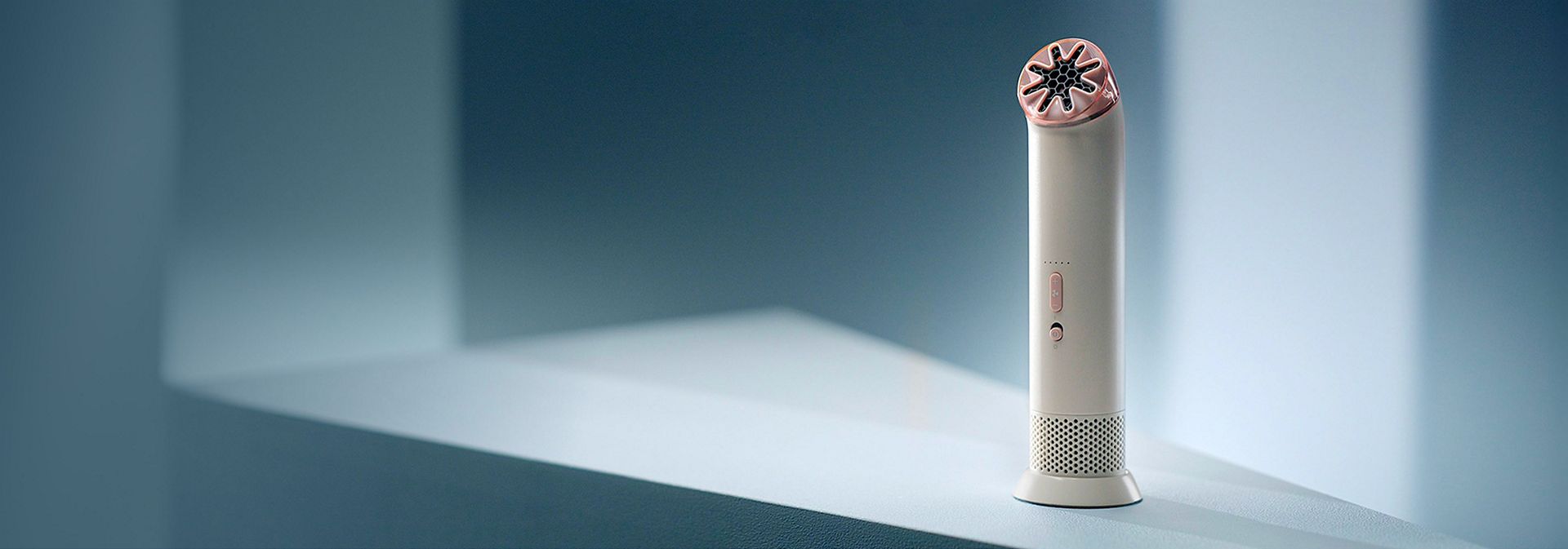 Dyson HushJet Mini Cool fan stood on a desk.