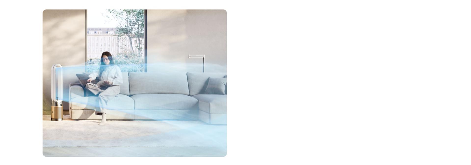 Dyson Find+Follow Purifier Cool fan cools a room with airflow while a person reads.