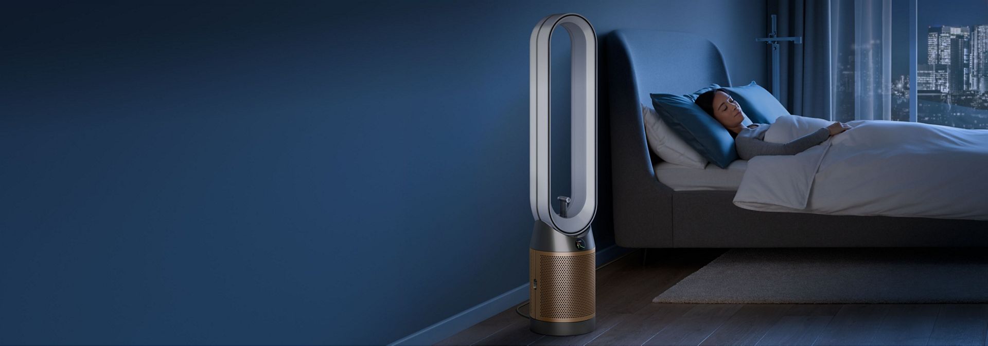 A person sleeps next to their Dyson Find+Follow Purifier Cool fan.
