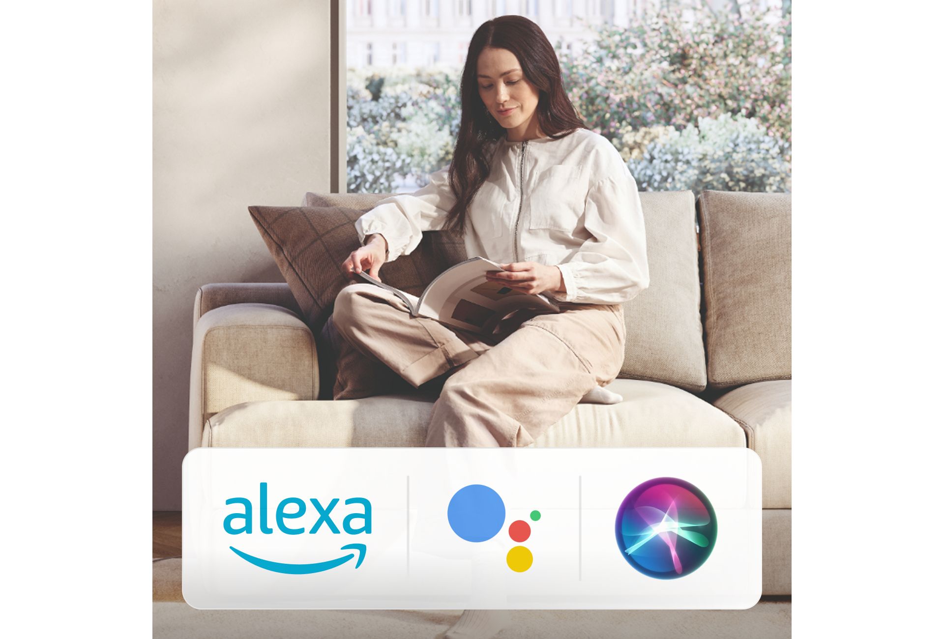 A Dyson Purifier projects air in a large living room. Logos for Amazon Alexa, Google Assistant and Siri.