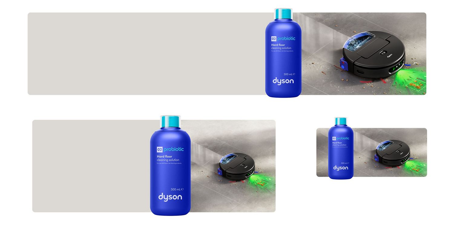 Dyson 02 Probiotic cleaning solution in front of the Spot+Scrub Ai robot vacuum cleaning a wet floor with illumination.