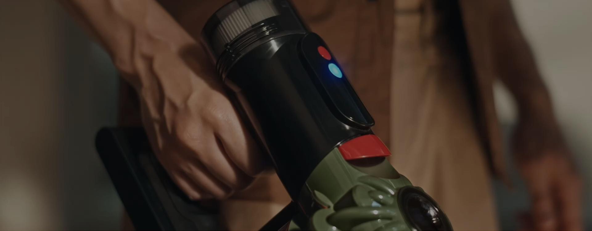 The power mode control button on the top of the Dyson V8 Cyclone vacuum cleaner.