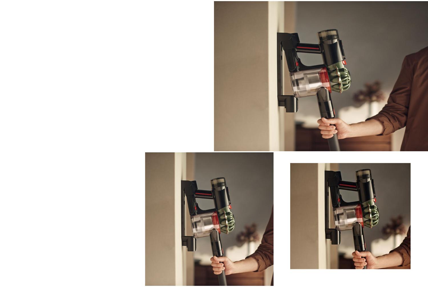 The Dyson V8 Cyclone vacuum is returned to its charging dock.
