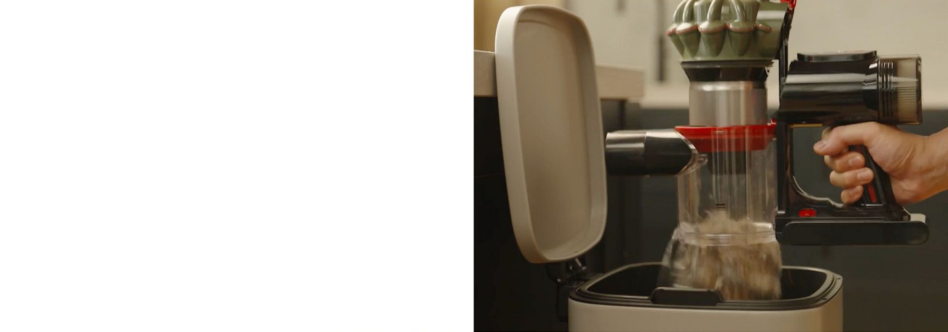 The Dyson V8 Cyclone cordless vacuum is emptied into a household bin.