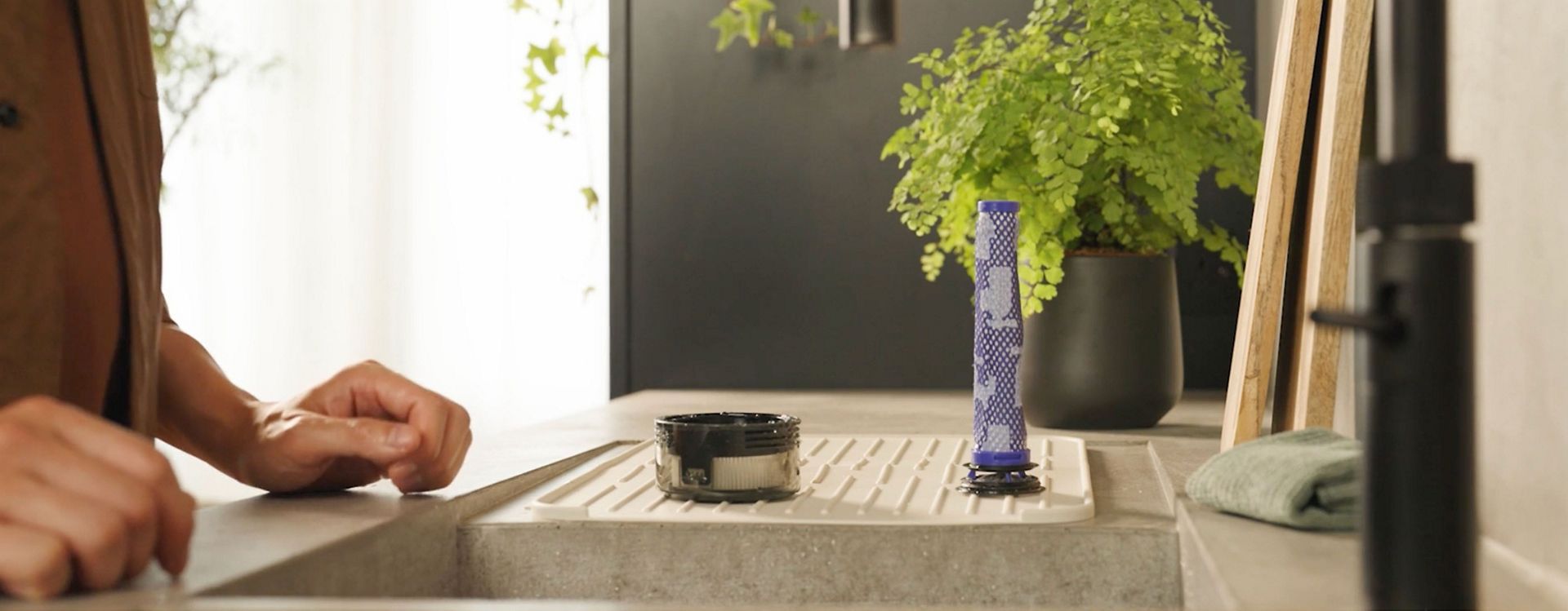 The Filters of the Dyson V8 Cyclone vacuum are left to dry after cleaning.