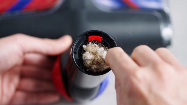 A blockage is cleared from the All Floor Cones Sense cleaner head.