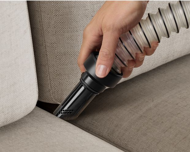 The Flexi hose tool is used to more easily clean between sofa cushions.