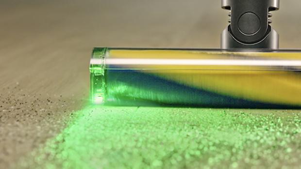 Dyson Fluffy Optic cleaner head illuminates and casts shadows on hard-to-see dust.