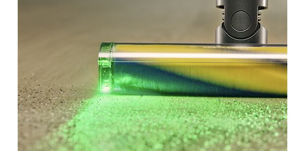 Dyson Fluffy Optic cleaner head illuminates and casts shadows on hard-to-see dust.