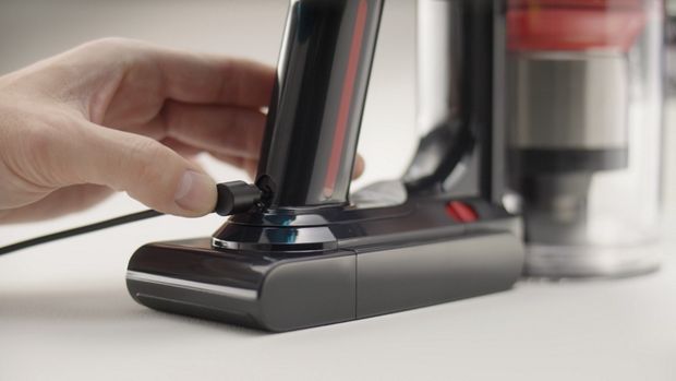 The charging cable is plugged into the battery.