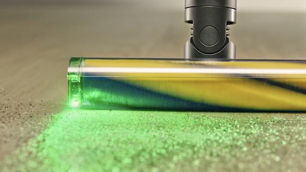 Dyson Fluffy Optic cleaner head illuminates and casts shadows on hard-to-see dust.
